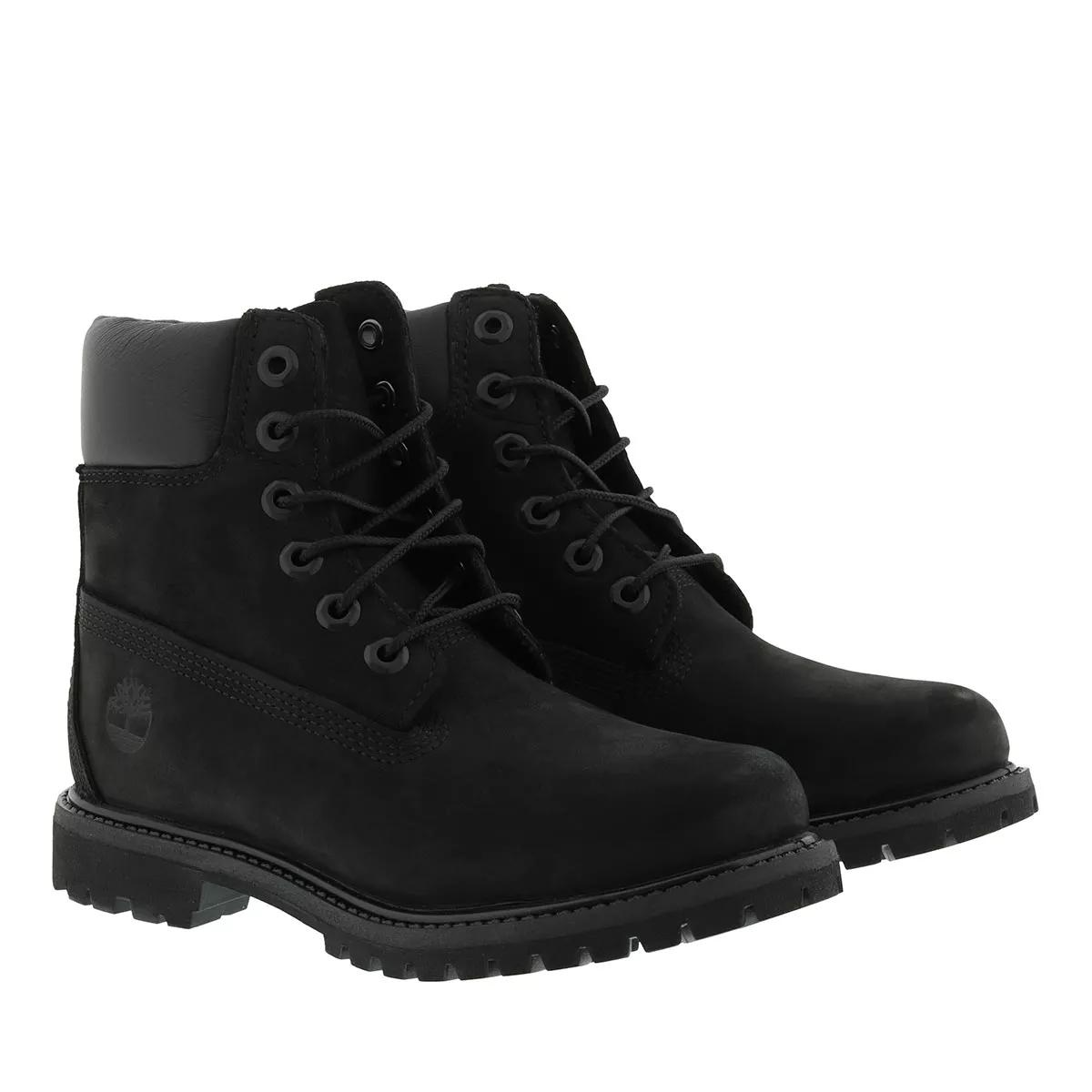 Long black timberland deals boots