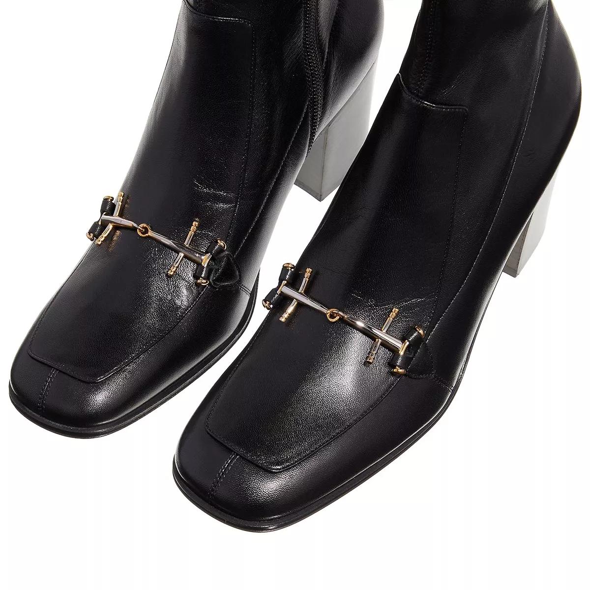 Burberry link detail patent leather hot sale ankle boots