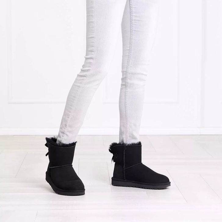 Black and white shop uggs with bows