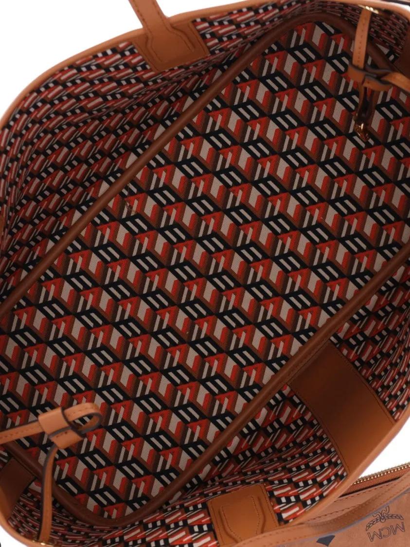 MCM Shoppers & Totes Structured Brown Bag With Distinctive Logo Pattern in bruin