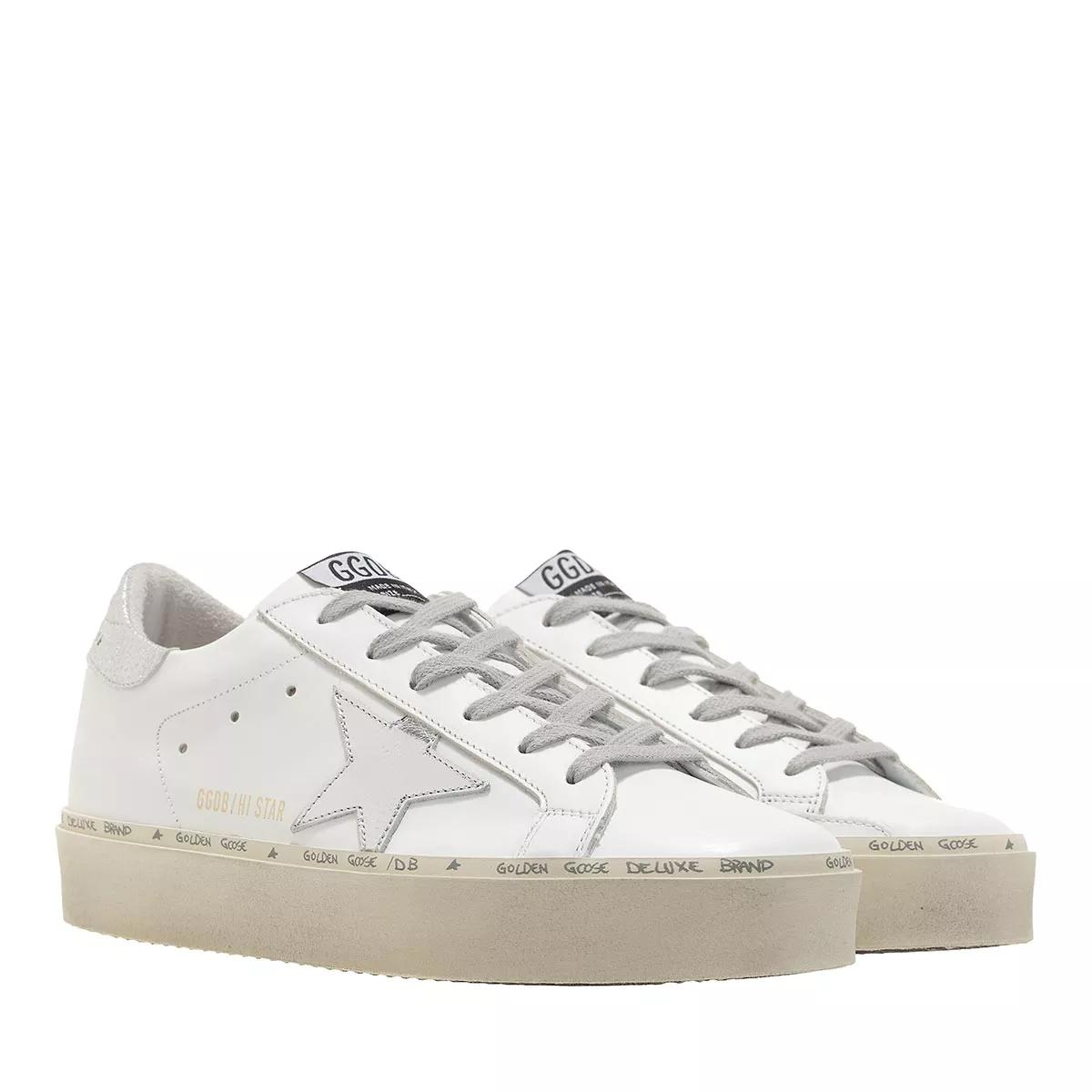 White sneakers with store silver stars