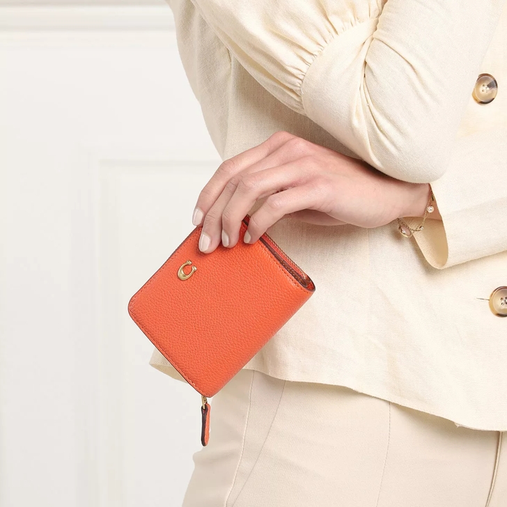 Orange best sale coach wallet