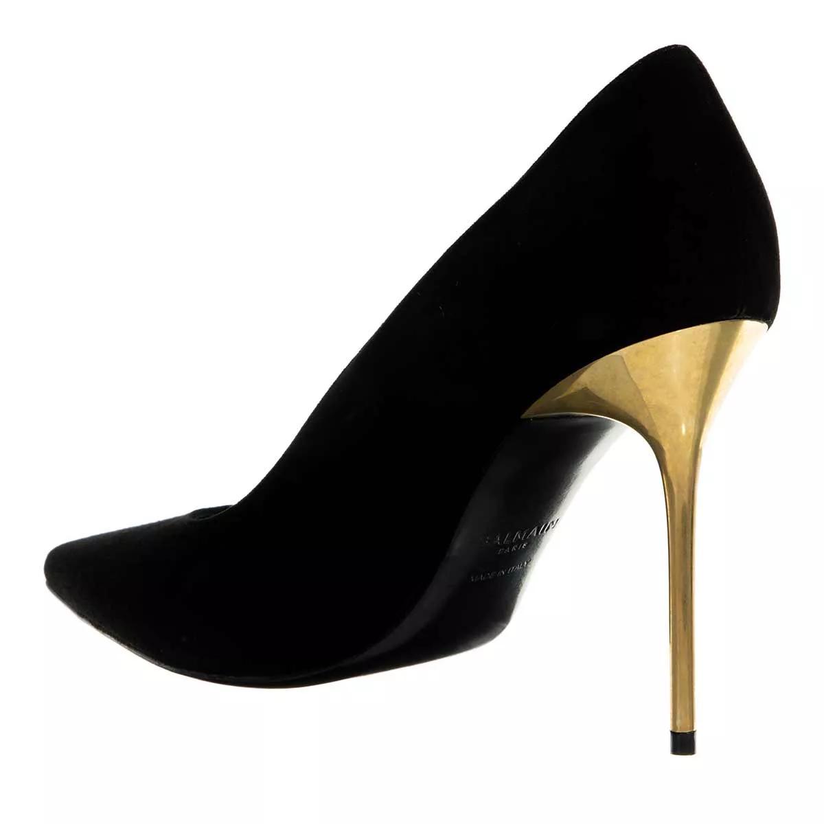 Black high heels sales with gold heel