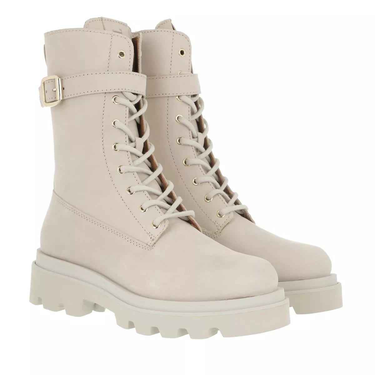 White lace up store biker boots