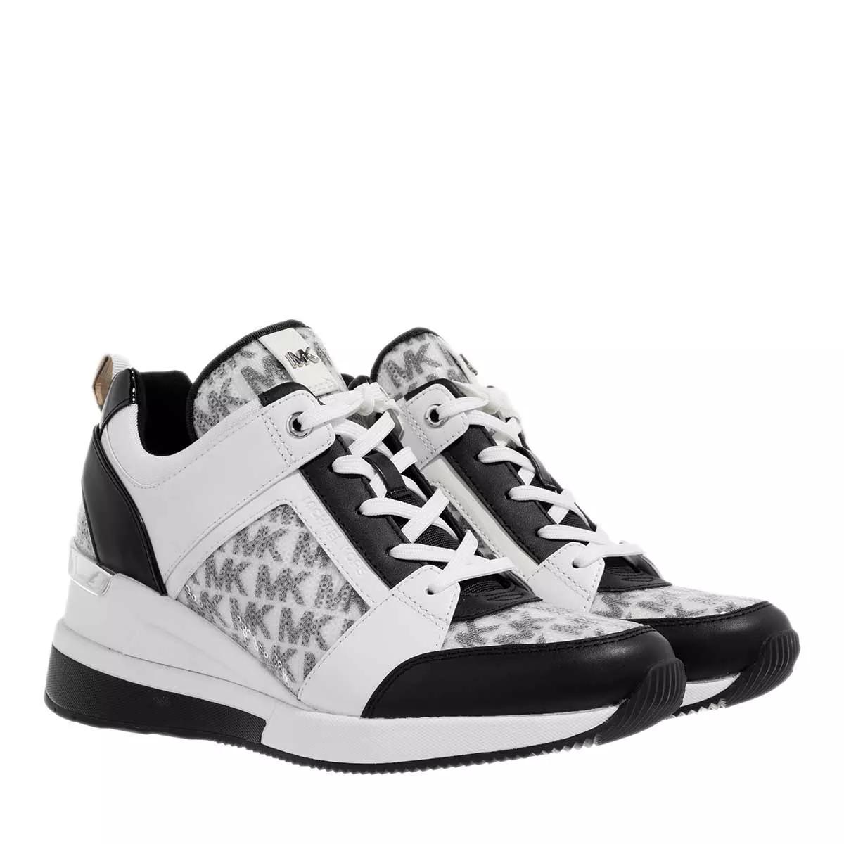 Michael kors black on sale and white tennis shoes