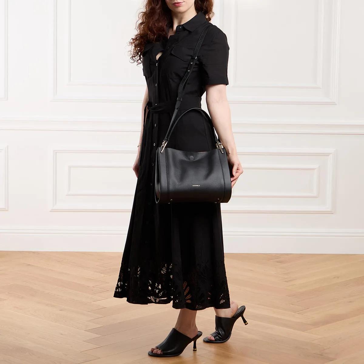 Coccinelle Leren tas met gehamerd textuur en gouden logo Black Dames