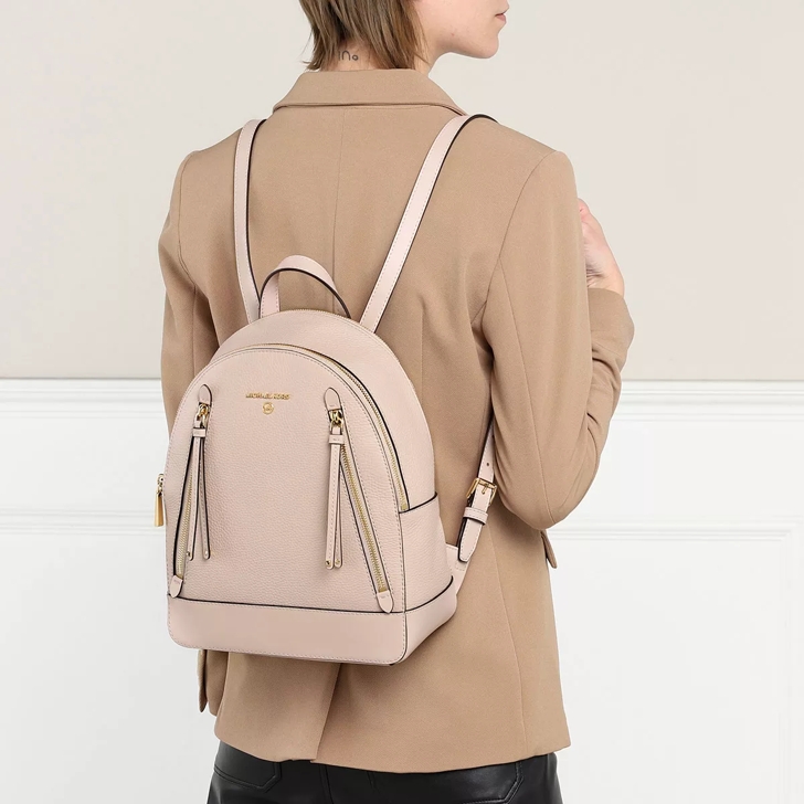 Light pink michael kors backpack 2025