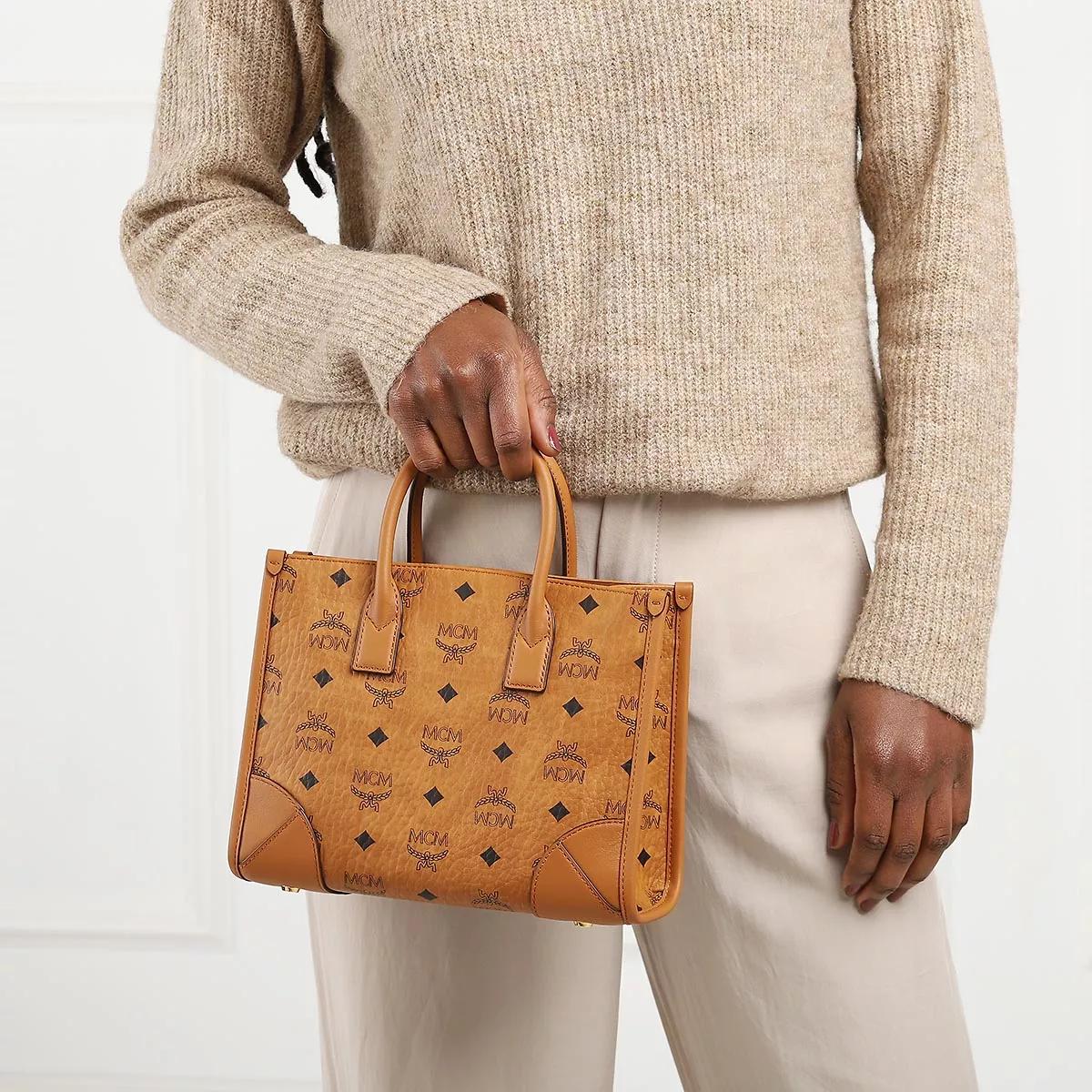 MCM Shoppers & Totes Munchen Tote in cognac