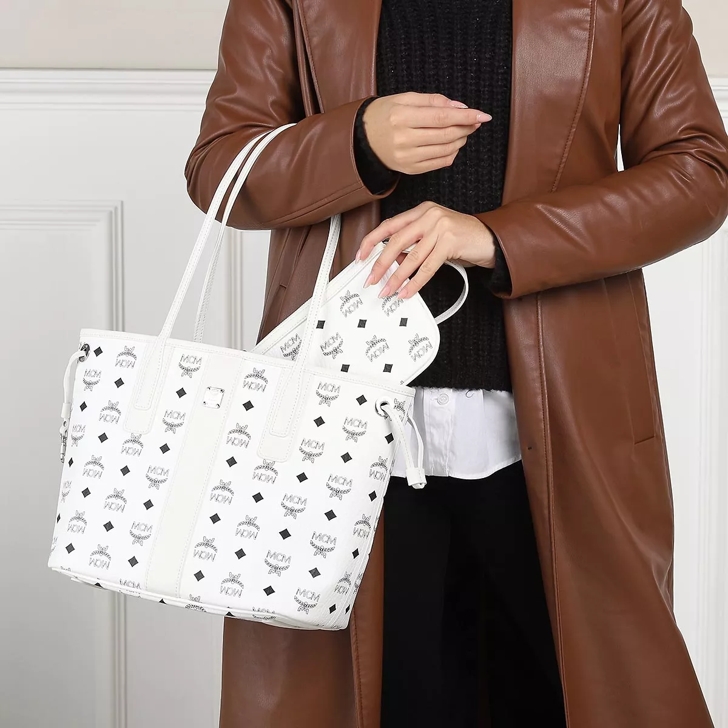 Is mcm white tote discount with studs on bottom real