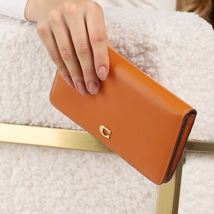 Slim best sale coach wallet