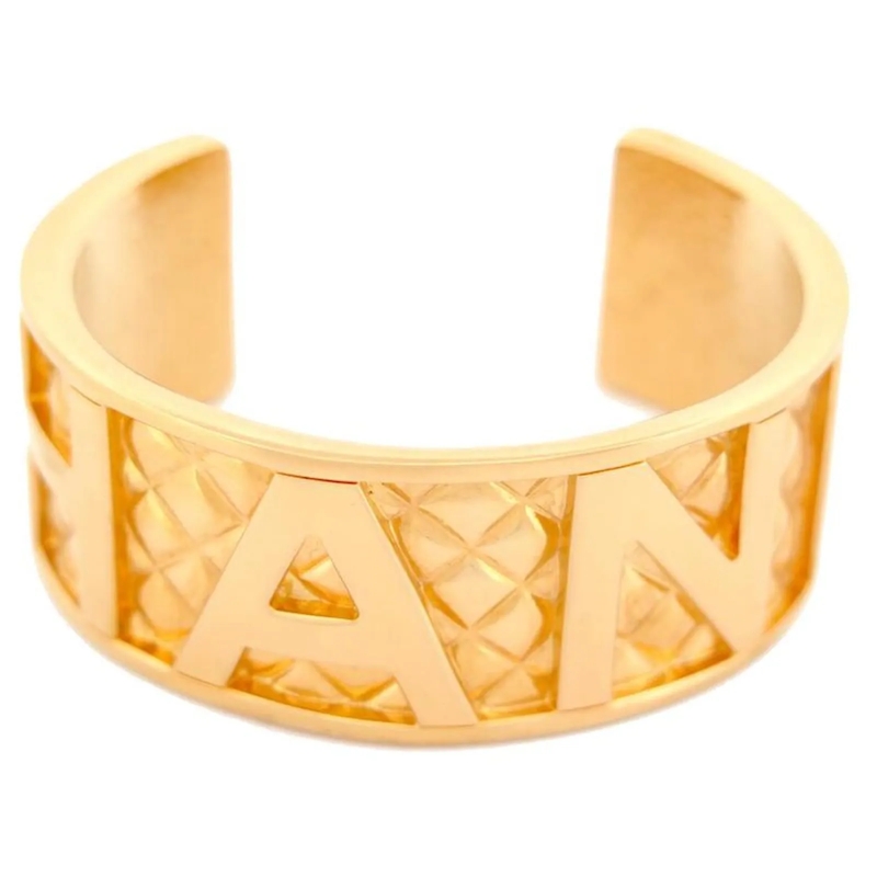 Chanel Armband VINTAGE CHANEL-LOGO GESTEPPTES MANSCHETTENARMBAND  gold