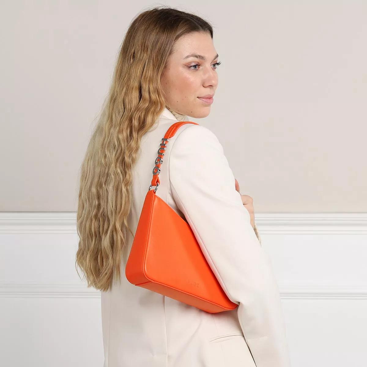 Orange leather shoulder on sale bag